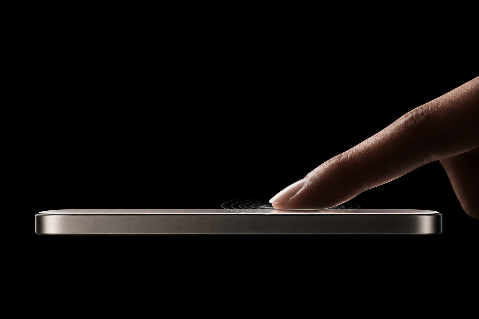 A finger pressing the hidden haptic zone beneath the glass